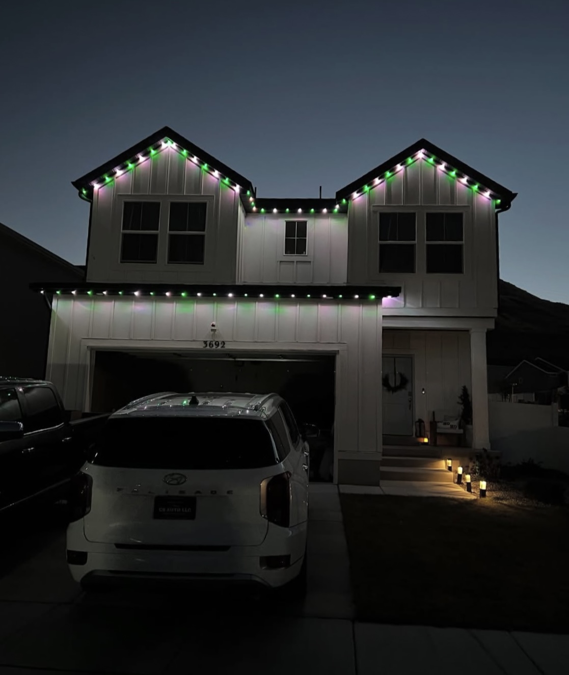 House with warm roofline lights